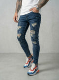JEAN SKINNY - VERDE TODO ROTO